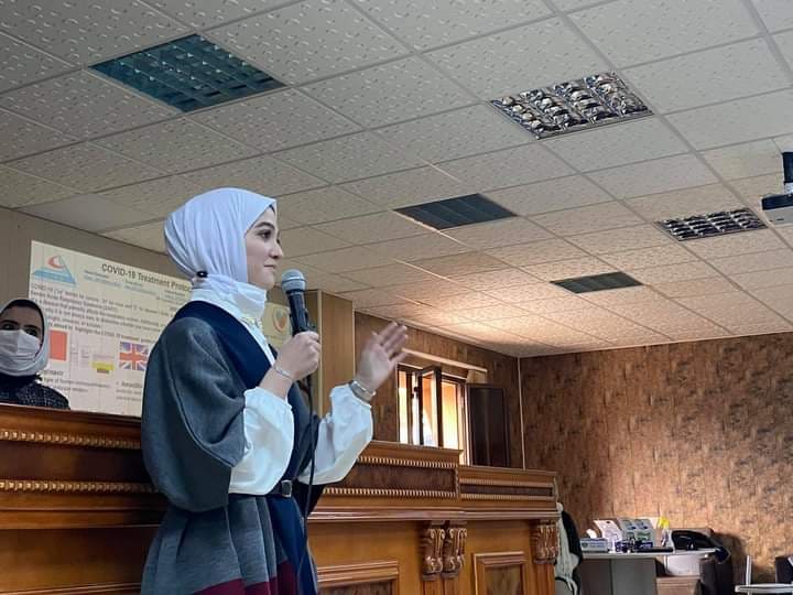 Faculty of pharmacy student presents her scientific poster at the seminar